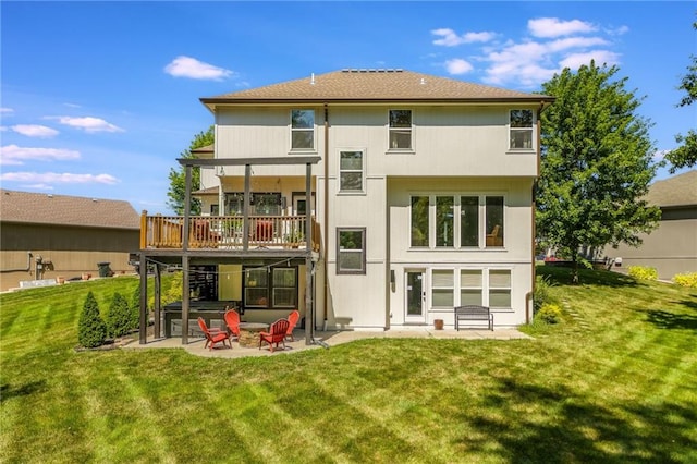 3536 SW Dana Ave, Lees Summit, MO 64082 - rear view of property featuring a patio, a lawn, and a wooden deck