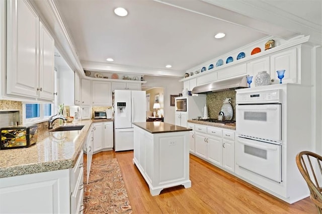 8422 Reinhardt Ln, Leawood, KS 66206 - kitchen with white appliances, ventilation hood, white cabinets, and recessed lighting