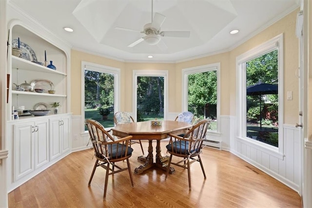 8422 Reinhardt Ln, Leawood, KS 66206 - dining space with a decorative wall, light wood-type flooring, healthy amount of natural light, ceiling fan, and a wainscoted wall