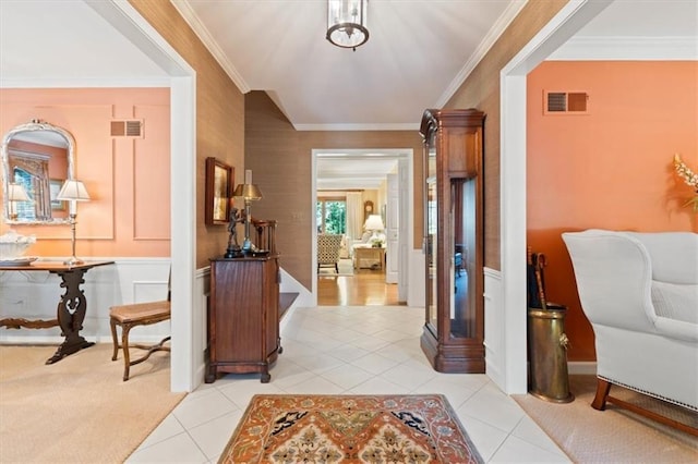 8422 Reinhardt Ln, Leawood, KS 66206 - entryway featuring crown molding, light tile patterned flooring, and a decorative wall