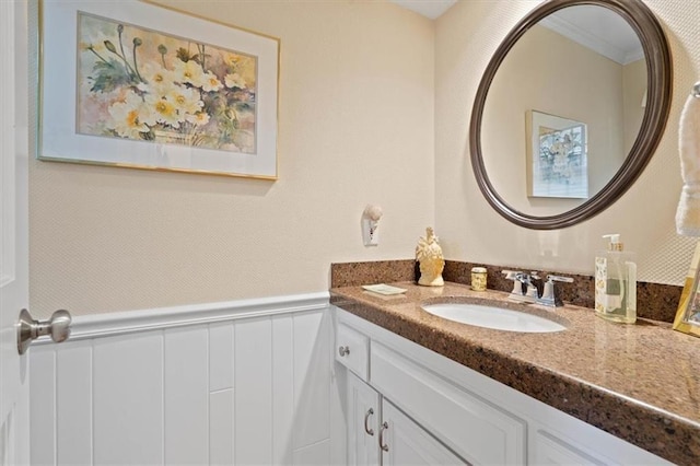 8422 Reinhardt Ln, Leawood, KS 66206 - bathroom with vanity, wainscoting, and a decorative wall