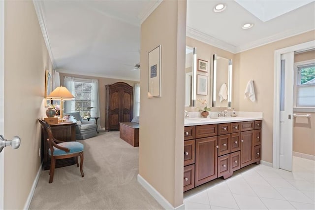 8422 Reinhardt Ln, Leawood, KS 66206 - bathroom featuring double vanity, crown molding, a skylight, ceiling fan, and recessed lighting