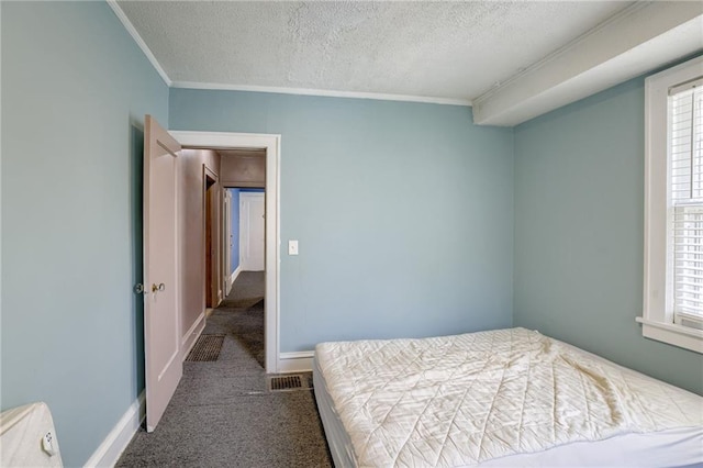 3509 Bellefontaine Ave, Kansas City, MO 64128 - carpeted bedroom featuring a textured ceiling and ornamental molding