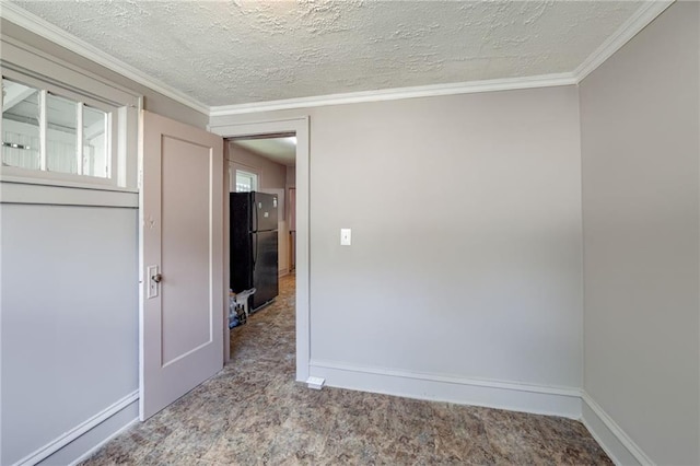 3509 Bellefontaine Ave, Kansas City, MO 64128 - carpeted spare room with a textured ceiling and crown molding