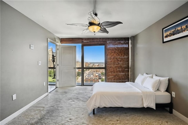 600 E Admiral Blvd Unit 1703, Kansas City, MO 64106 - carpeted bedroom featuring baseboards and ceiling fan