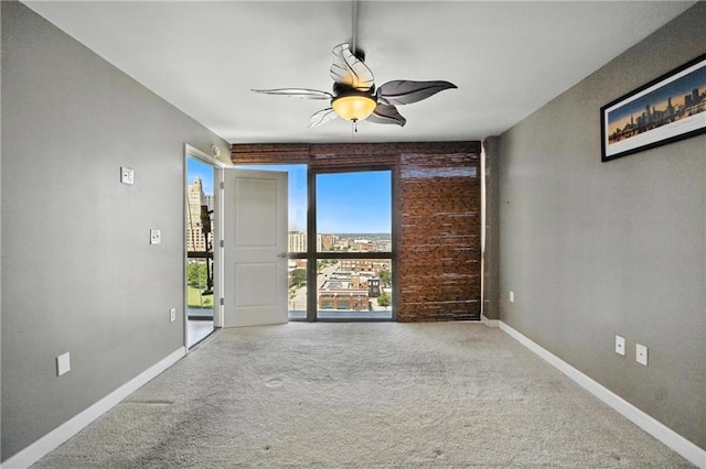 600 E Admiral Blvd Unit 1703, Kansas City, MO 64106 - unfurnished room featuring carpet flooring and ceiling fan