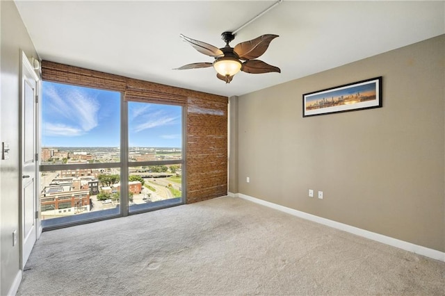 600 E Admiral Blvd Unit 1703, Kansas City, MO 64106 - carpeted empty room with baseboards and a ceiling fan