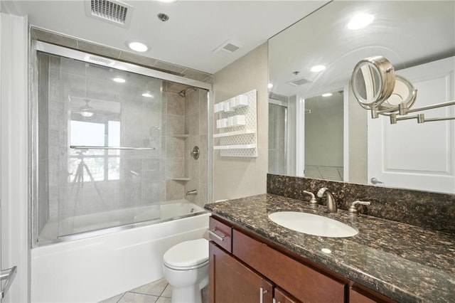600 E Admiral Blvd Unit 1703, Kansas City, MO 64106 - full bath with vanity, bath / shower combo with glass door, and tile patterned flooring
