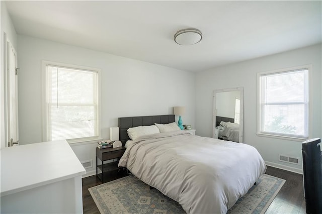 6015 W 78th Ter, Prairie Village, KS 66208 - bedroom featuring multiple windows and dark wood-style flooring