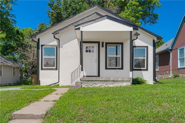 1832 N 31st St, Kansas City, KS 66104 - bungalow featuring stucco siding and a front lawn