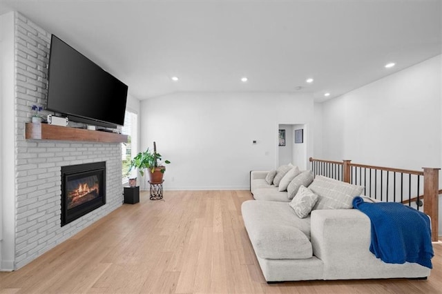 118 NW Grady Ct, Lees Summit, MO 64081 - living room featuring light wood finished floors, recessed lighting, and a fireplace