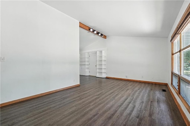 7604 Tomahawk Rd, Prairie Village, KS 66208 - spare room featuring dark wood-type flooring and rail lighting