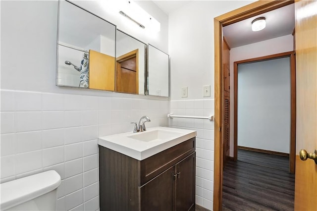 7604 Tomahawk Rd, Prairie Village, KS 66208 - full bathroom with tile walls, vanity, wood finished floors, wainscoting, and a shower with curtain
