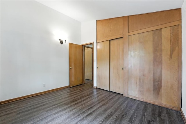 7604 Tomahawk Rd, Prairie Village, KS 66208 - unfurnished bedroom featuring dark wood-style floors and two closets