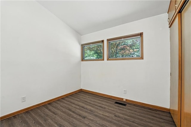 7604 Tomahawk Rd, Prairie Village, KS 66208 - unfurnished bedroom with dark wood-style flooring and a closet