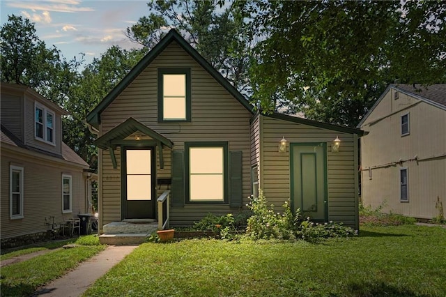 6016 Harrison St, Kansas City, MO 64110 - view of front of home with a front lawn