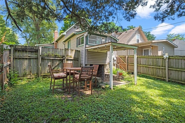6016 Harrison St, Kansas City, MO 64110 - back of property with a fenced backyard