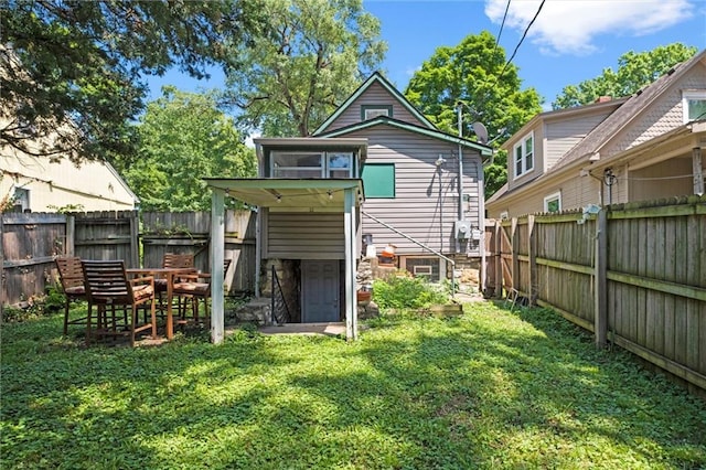 6016 Harrison St, Kansas City, MO 64110 - back of house featuring a fenced backyard