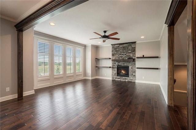 16699 S Chalet Dr, Olathe, KS 66062 - unfurnished living room featuring ceiling fan, ornamental molding, dark wood-style flooring, a fireplace, and recessed lighting