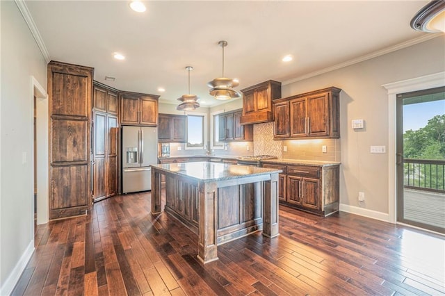 16699 S Chalet Dr, Olathe, KS 66062 - kitchen with fridge with ice dispenser, dark wood-type flooring, tasteful backsplash, healthy amount of natural light, and crown molding