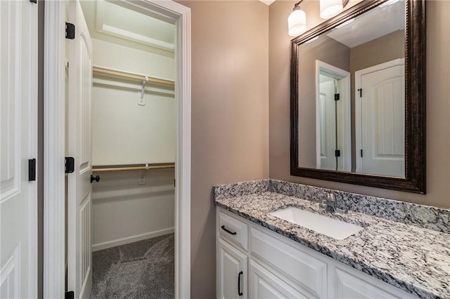 16699 S Chalet Dr, Olathe, KS 66062 - bathroom featuring vanity and a walk in closet