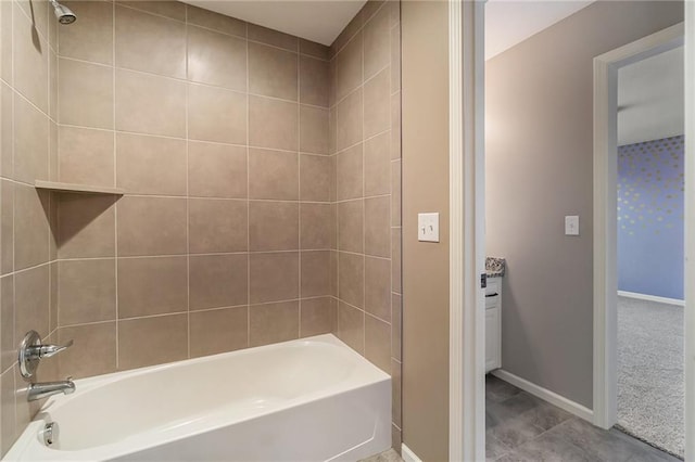 16699 S Chalet Dr, Olathe, KS 66062 - bathroom featuring tub / shower combination and tile patterned flooring