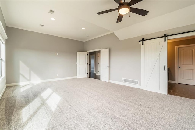 16699 S Chalet Dr, Olathe, KS 66062 - spare room with carpet floors, ceiling fan, a barn door, recessed lighting, and ornamental molding