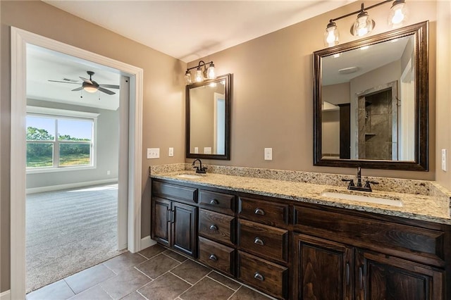 16699 S Chalet Dr, Olathe, KS 66062 - bathroom with double vanity, a ceiling fan, tile patterned floors, and tiled shower