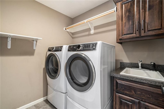 16699 S Chalet Dr, Olathe, KS 66062 - washroom with separate washer and dryer, cabinet space, and light tile patterned flooring