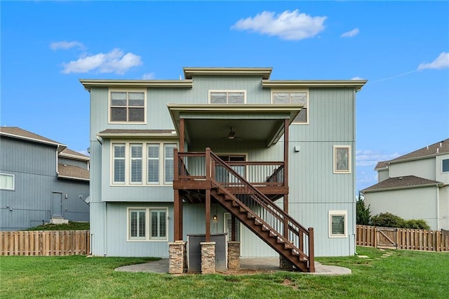 16699 S Chalet Dr, Olathe, KS 66062 - back of property featuring ceiling fan, stairs, a wooden deck, and a fenced backyard