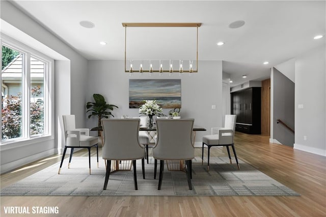 2616 W 112th St, Leawood, KS 66211 - dining space featuring wood finished floors and recessed lighting