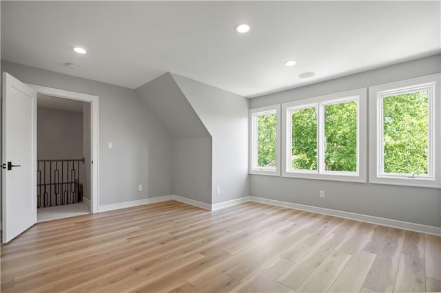 2616 W 112th St, Leawood, KS 66211 - additional living space with healthy amount of natural light, light wood-style floors, and recessed lighting