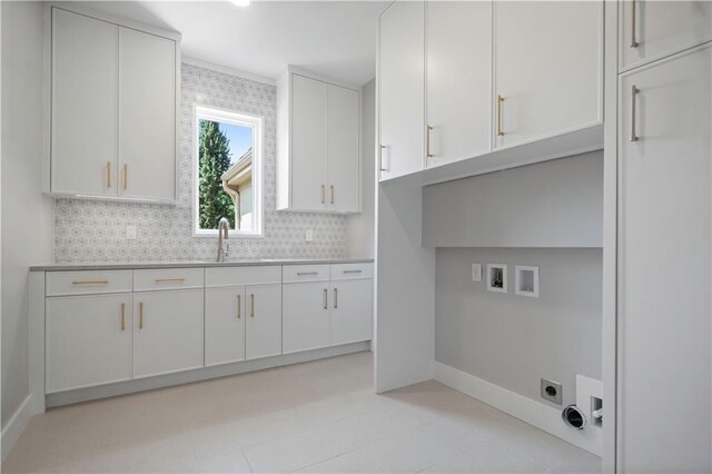 2616 W 112th St, Leawood, KS 66211 - laundry room featuring hookup for an electric dryer, hookup for a washing machine, and cabinet space