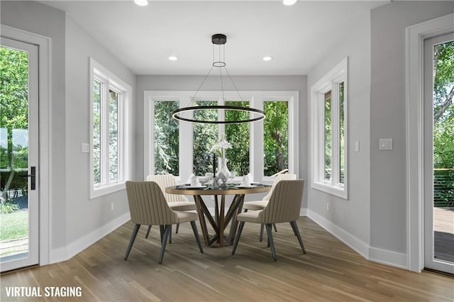 2616 W 112th St, Leawood, KS 66211 - dining area with plenty of natural light, wood finished floors, and recessed lighting