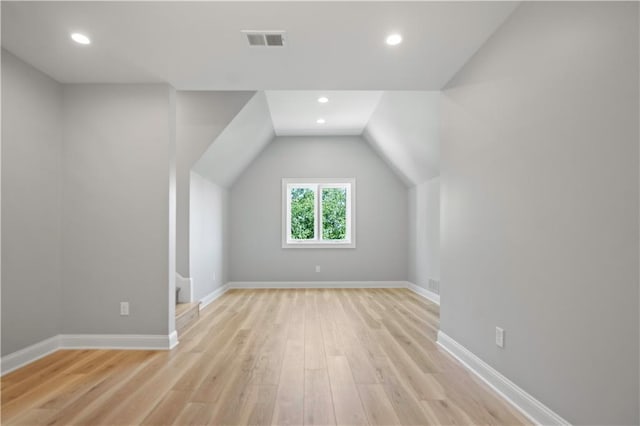 2616 W 112th St, Leawood, KS 66211 - bonus room with light wood finished floors, vaulted ceiling, and recessed lighting