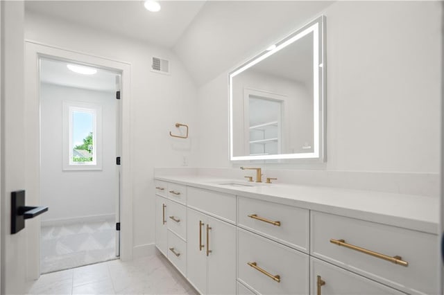 2616 W 112th St, Leawood, KS 66211 - bathroom with vanity, vaulted ceiling, marble finish floors, and recessed lighting