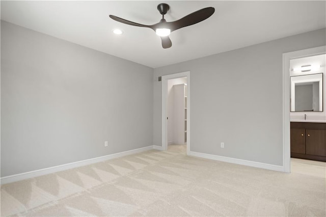 2616 W 112th St, Leawood, KS 66211 - unfurnished bedroom featuring light carpet, ensuite bath, ceiling fan, a spacious closet, and recessed lighting