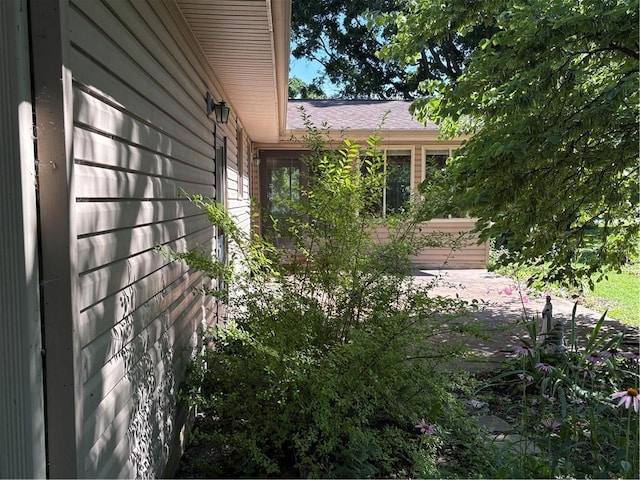 105 N Hayes St, Garnett, KS 66032 - view of side of property featuring a patio area