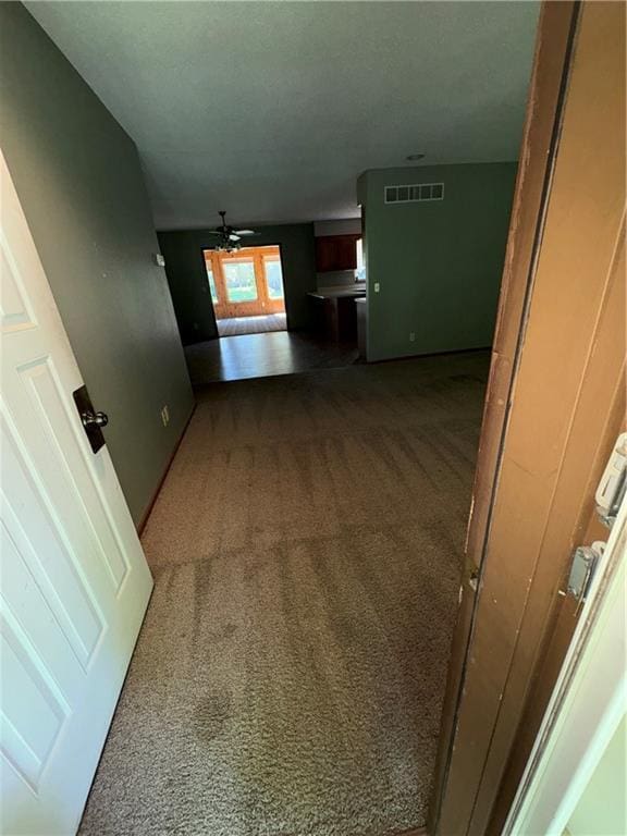 105 N Hayes St, Garnett, KS 66032 - corridor with carpet floors