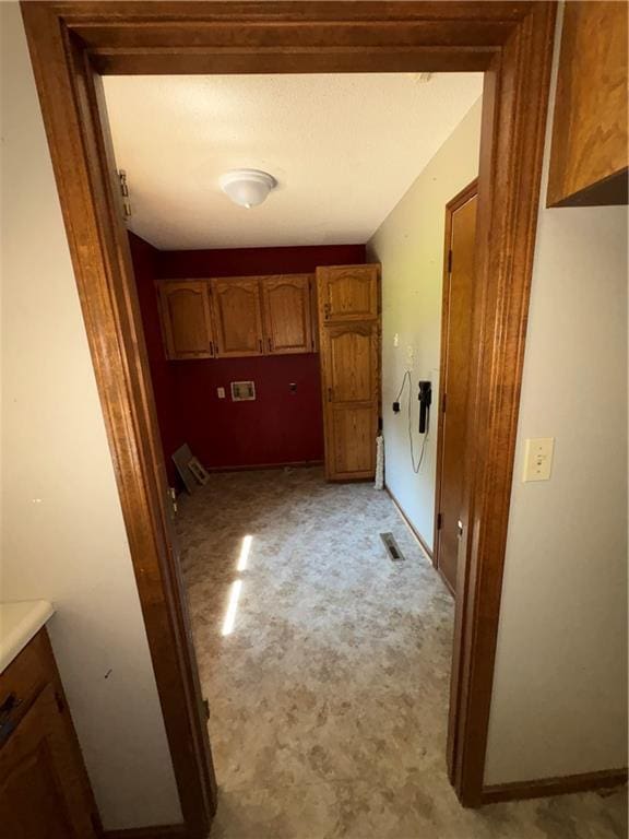 105 N Hayes St, Garnett, KS 66032 - corridor with light colored carpet