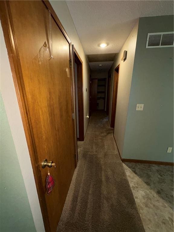 105 N Hayes St, Garnett, KS 66032 - hall with carpet flooring and a textured ceiling