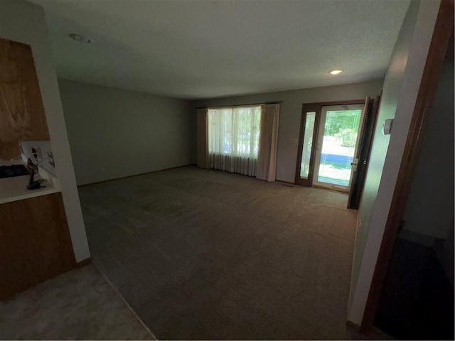 105 N Hayes St, Garnett, KS 66032 - unfurnished living room featuring carpet flooring