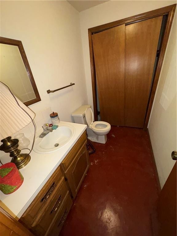 105 N Hayes St, Garnett, KS 66032 - bathroom with vanity and finished concrete floors