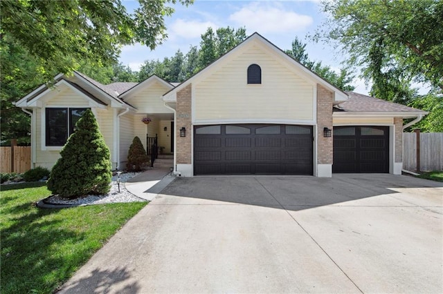 1311 SE Eastridge Cir, Blue Springs, MO 64014 - single story home with a garage, driveway, and brick siding