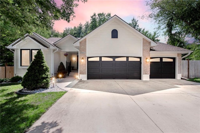 1311 SE Eastridge Cir, Blue Springs, MO 64014 - single story home with an attached garage, driveway, and brick siding