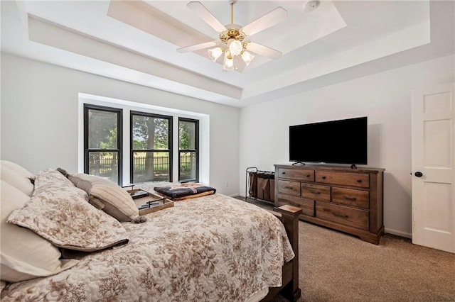 1311 SE Eastridge Cir, Blue Springs, MO 64014 - carpeted bedroom featuring a tray ceiling and ceiling fan