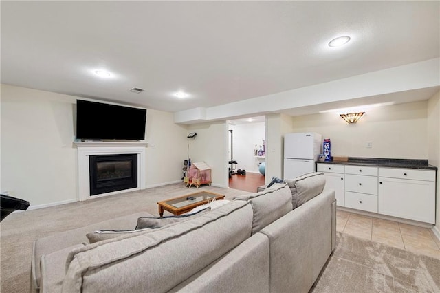 1311 SE Eastridge Cir, Blue Springs, MO 64014 - living area with recessed lighting, light carpet, and a glass covered fireplace
