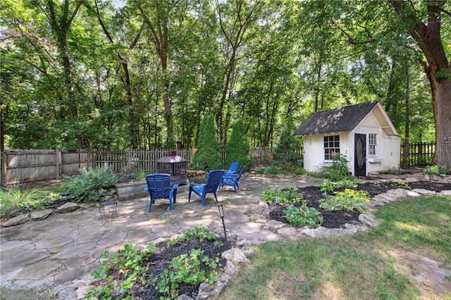 1311 SE Eastridge Cir, Blue Springs, MO 64014 - fenced backyard featuring a patio area and an outbuilding