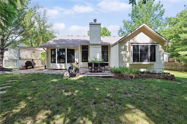 1311 SE Eastridge Cir, Blue Springs, MO 64014 - rear view of house featuring a patio area and a chimney
