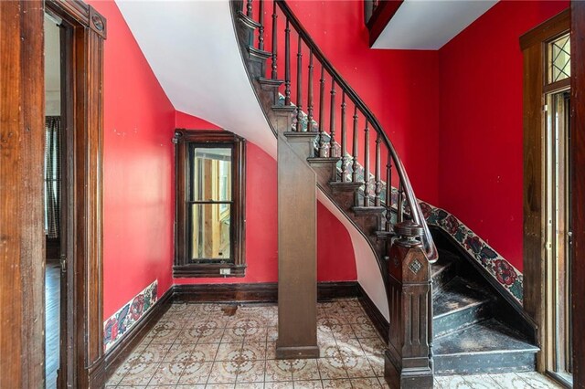 118 Spruce St, Leavenworth, KS 66048 - staircase featuring baseboards and tile patterned floors